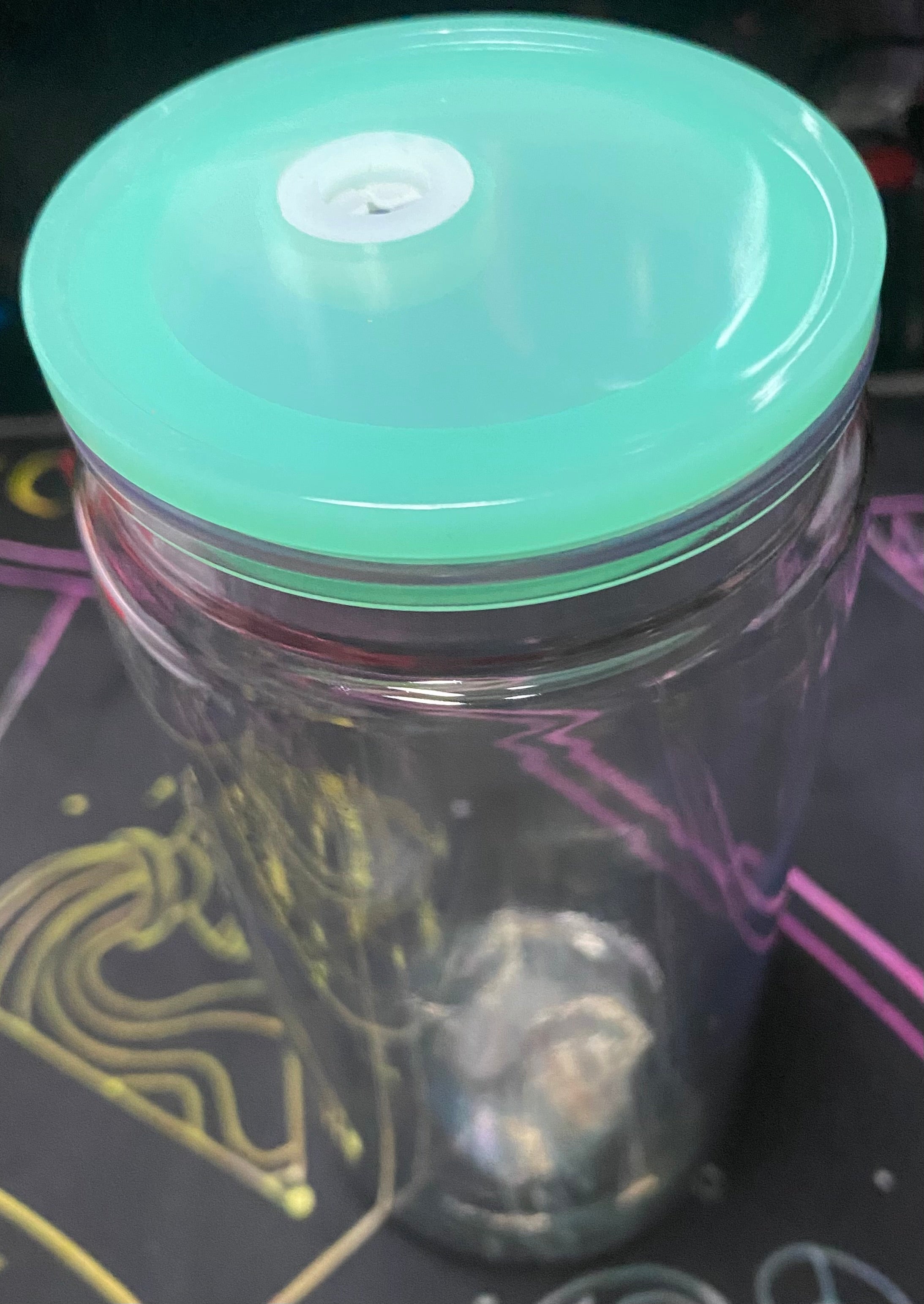 Clear container with a green lid
