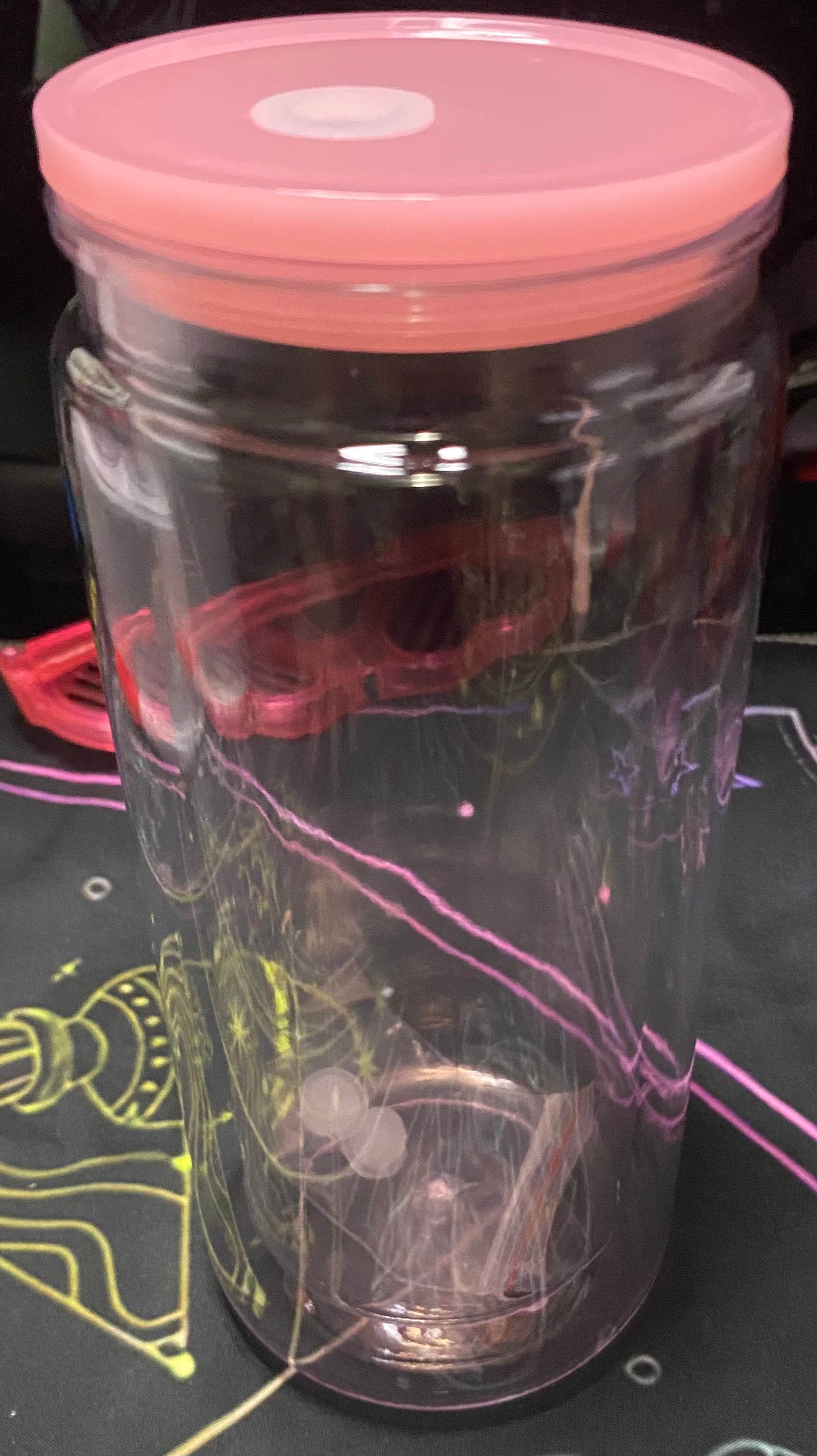 Clear tumbler with a pink lid 