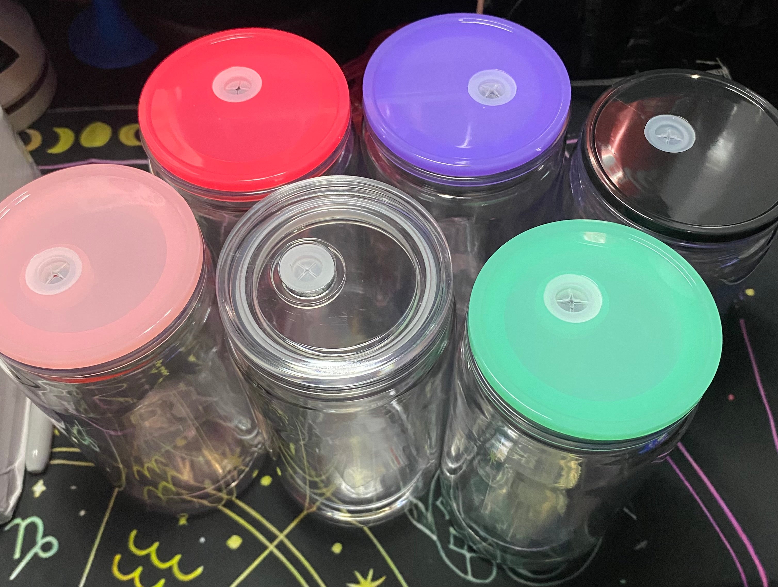 Set of clear jars with colorful lids