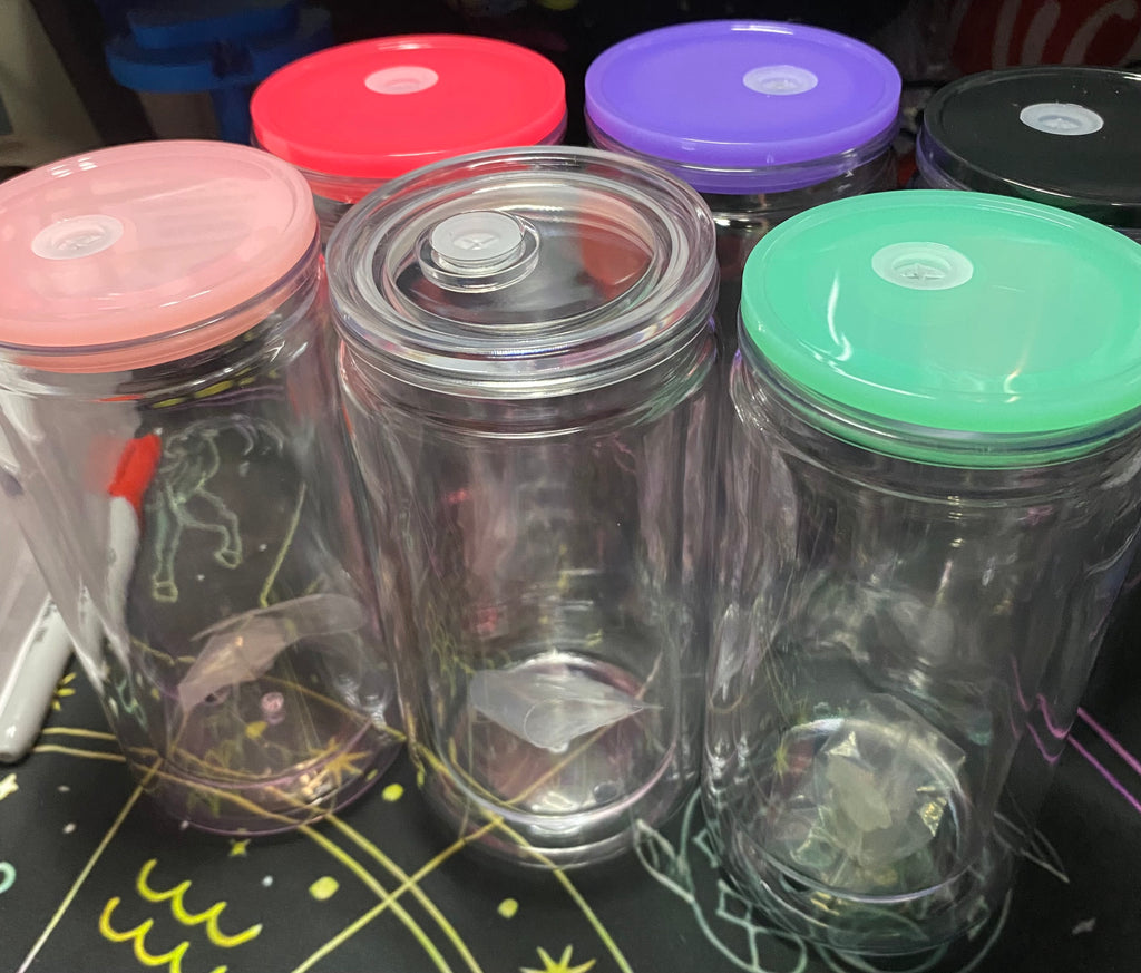 Clear plastic tumblers with colorful lids 