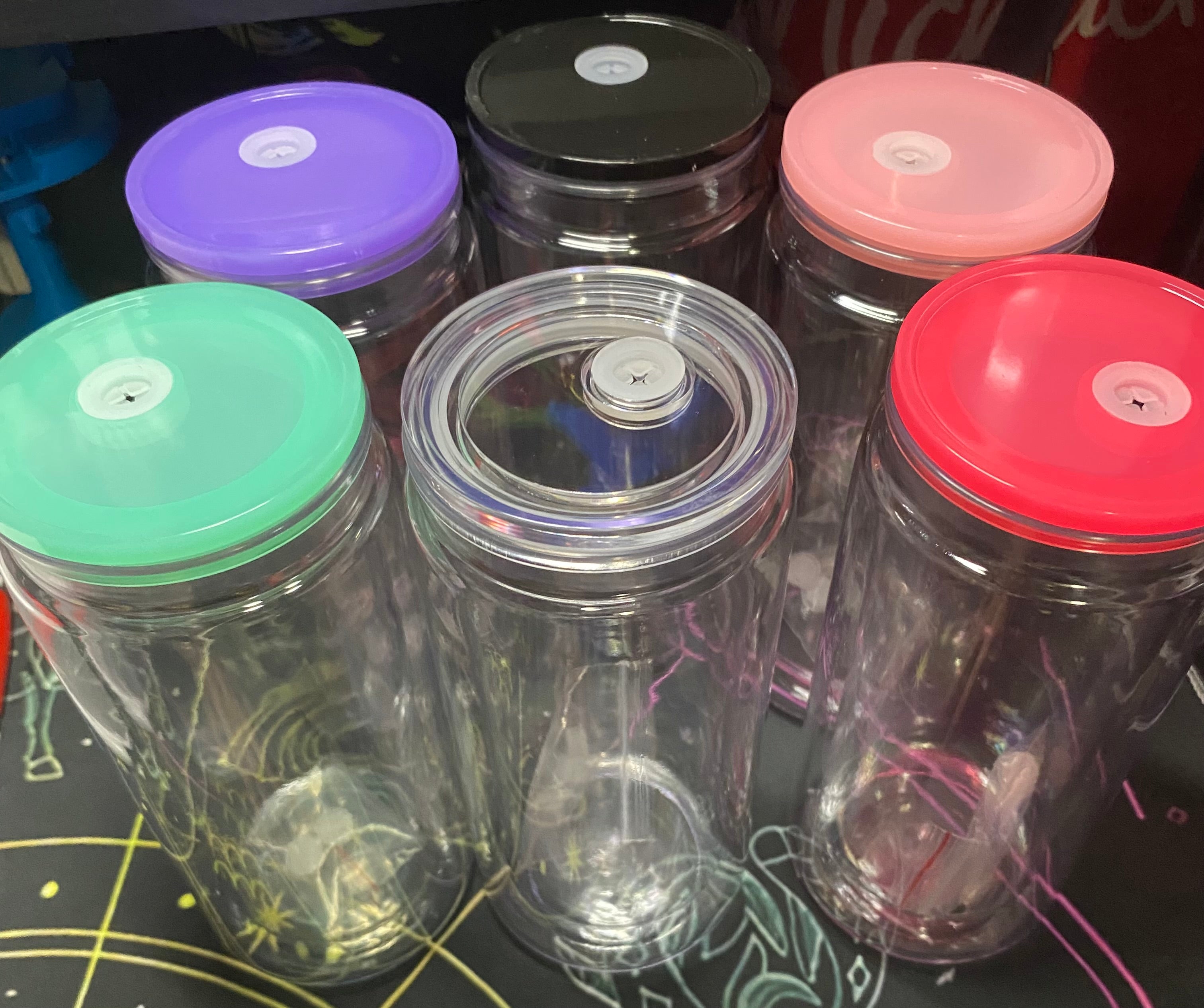 Clear plastic containers with colorful lids