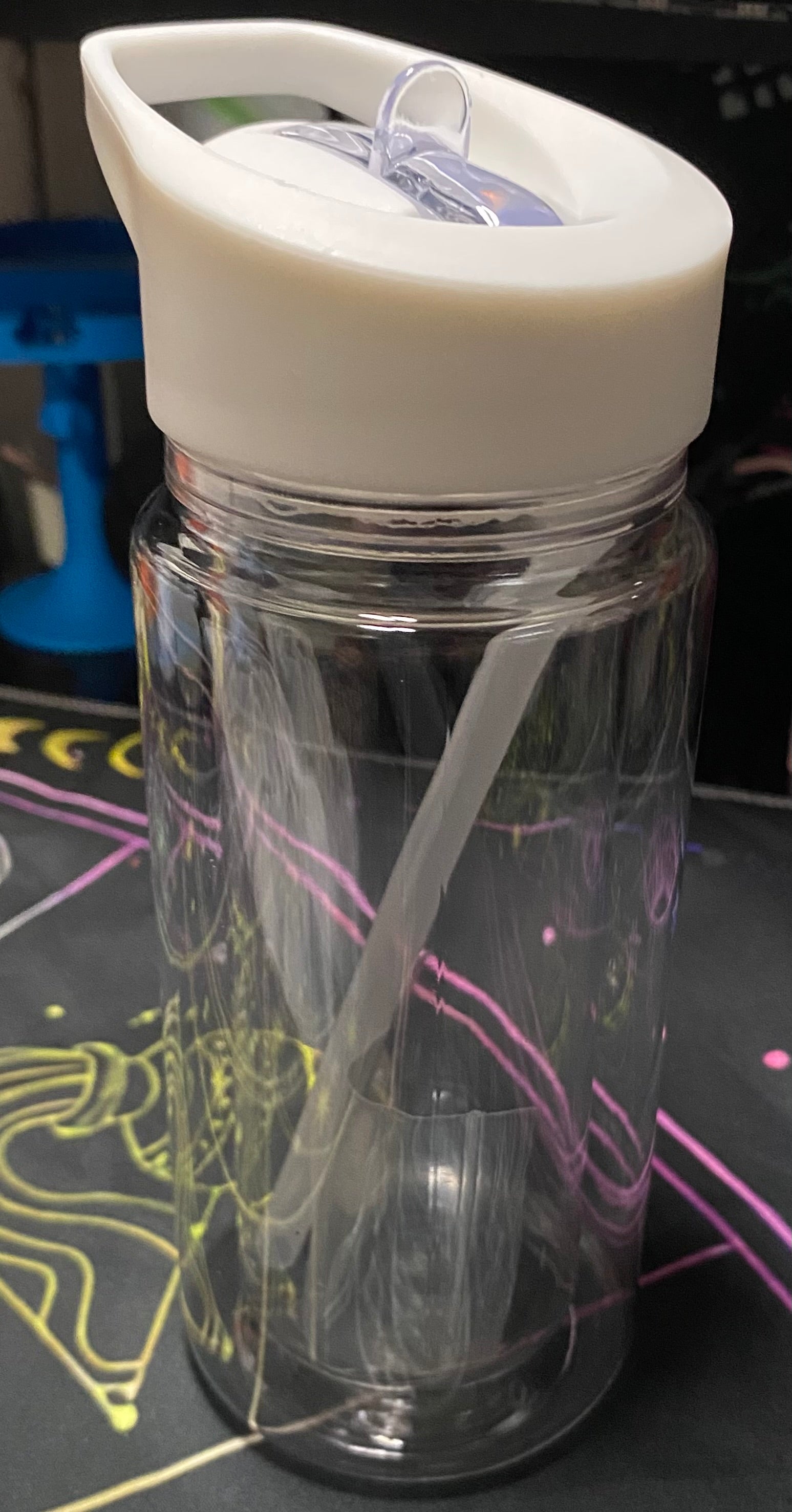 Clear tumbler with a white lid